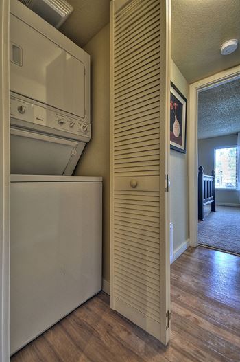 Stackable washer and dryer located inside the apartment home.at Fountains of Fair Oaks, Fair Oaks, CA 95628
